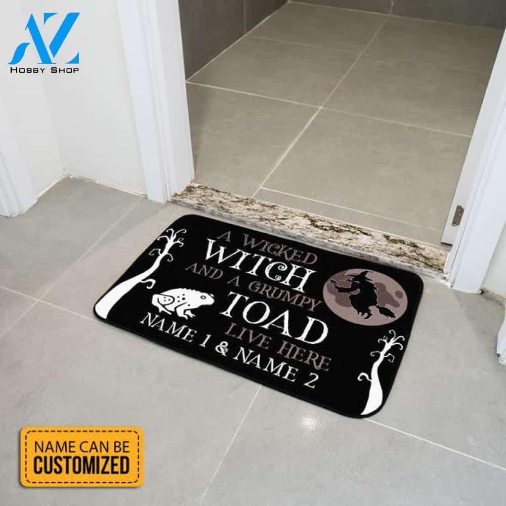 A Wicked Witch And A Grumpy Toad Live Here Rectangular Black Doormat