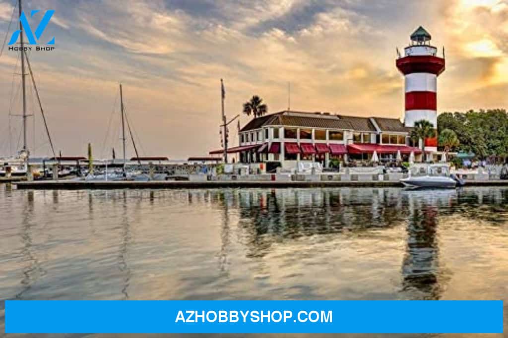Hilton Head Island South Carolina - Harbour Town Lighthouse At Sunset Reflected On Water
