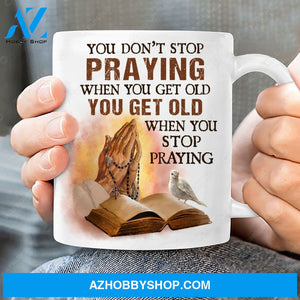 Praying hand, White dove, Old bible, You don't stop praying when you get old - Jesus White Mug