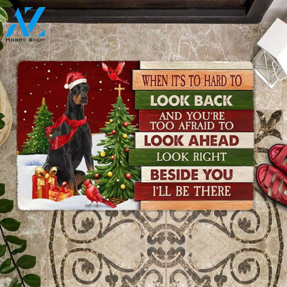 Christmas Doberman 2 Look right beside you Doormat