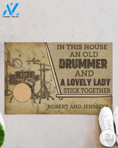 Personalized In this house and old drummer and a lovely lady stick together doormat