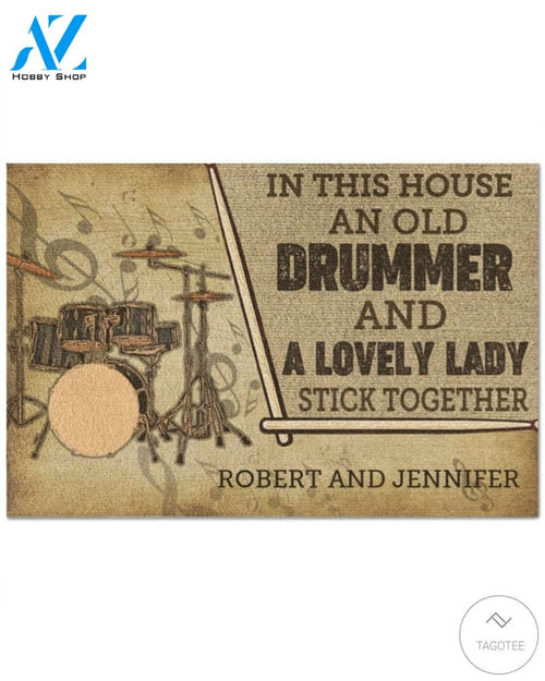 Personalized In this house and old drummer and a lovely lady stick together doormat