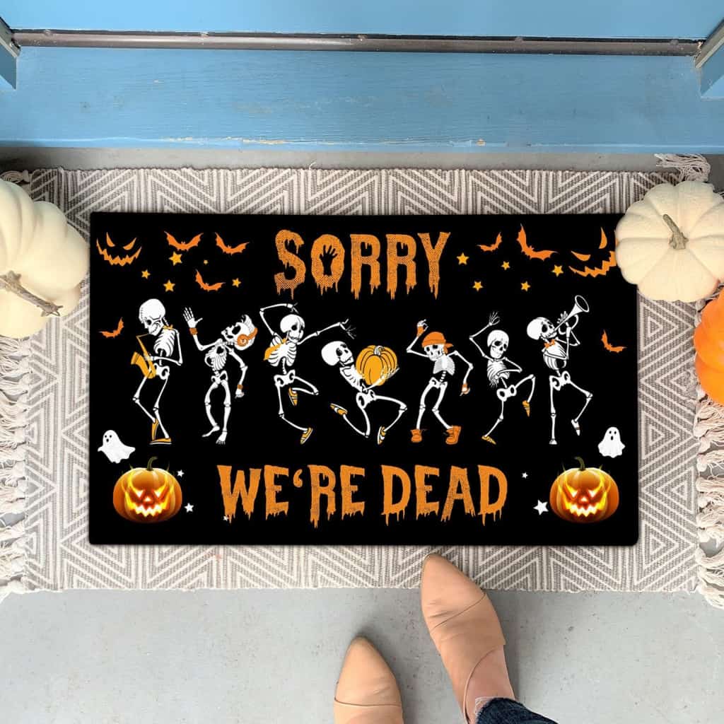SORRY WE'RE DEAD SKELETON DOORMAT