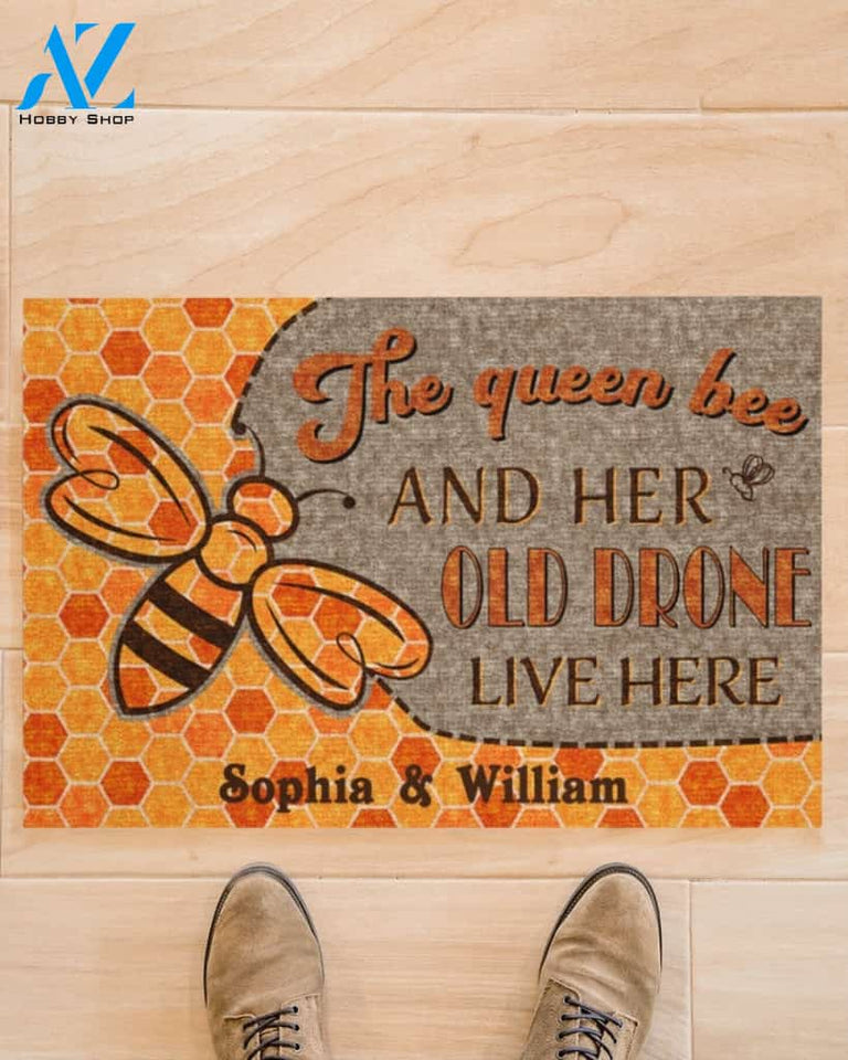 The queen bee and her old drone live here doormat